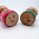Photos showing the signature and seal of kokeshi doll artisan Hashime Takahashi
