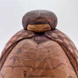 A close-up photo of a painstakingly hand-carved sosaku / kindai kokeshi doll is by multi-award-winning master artisan Yuji Watanabe. The amount of detail on this rare vintage kokeshi is stunning—just look at the texture of her hair and patterns on her kimono. This is a large, substantial objét that really should be referred to as a sculpture rather than a "doll."
