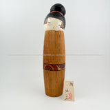 Gorgeous Kokeshi Doll! This hand-carved and hand-painted Japanese kokeshi doll is by legendary kokeshi artisan Izumi Oki. She has such a  peaceful yet elegant expression and her delicately hand-carved torso is accented with subtle strokes of gold paint; this is a modern masterpiece!