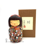 Kokeshi. Gorgeous, colorful, exquisitely hand-made Japanese kokeshi doll by Ichiko Yahagi. This doll, carefully handmade by award-winning artisan Ichiko Yahagai, is absolutely fabulousl Her geometric kimono is so detailed! And the quirky expression on her face is unlike the faces seen on any other kind of kokeshi doll. A true treasure! Rare and beautiful. One of a kind!