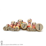 A photo showing the signature of kokeshi artist Toshio Takada. SUB-CATEGORIES: Yajiro Kokeshi