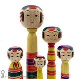 Kokeshi Family. Five Yajiro Kokeshi, Yellow with Stripes by Takashi Kamata. Dento Kokeshi.