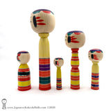 Kokeshi Family. Five Yajiro Kokeshi, Yellow with Stripes by Takashi Kamata. Dento Kokeshi.