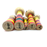 Kokeshi Family. Five Yajiro Kokeshi, Yellow with Stripes by Takashi Kamata. Dento Kokeshi.