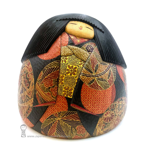 A gorgeous brand new kokeshi by award-winning artist Yuji Watanabe. A large sculptural kokeshi with endless fine detail. She has a peaceful expression and her kimono is spectacular. One of a kind. Only available at JapaneseKokeshiDolls.com