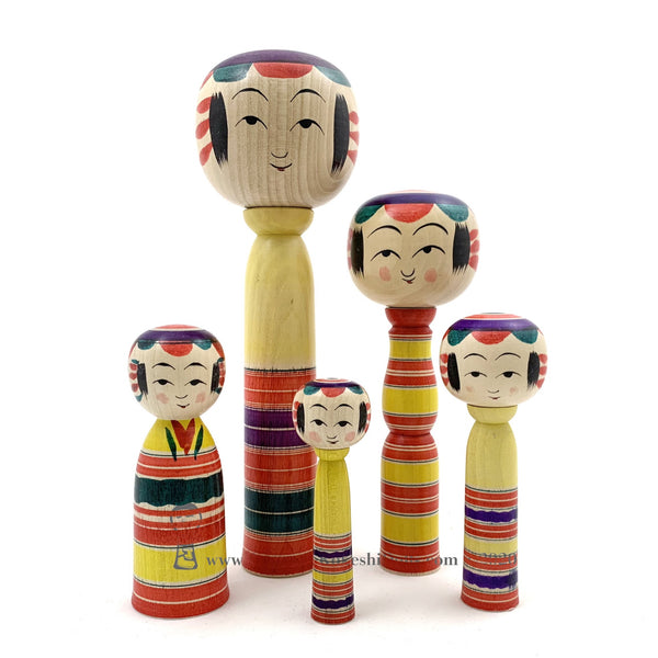 Kokeshi Family. Five Yajiro Kokeshi, Yellow with Stripes by Takashi Kamata. Dento Kokeshi.