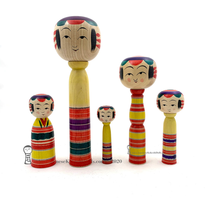 Kokeshi Family. Five Yajiro Kokeshi, Yellow with Stripes by Takashi Kamata. Dento Kokeshi.